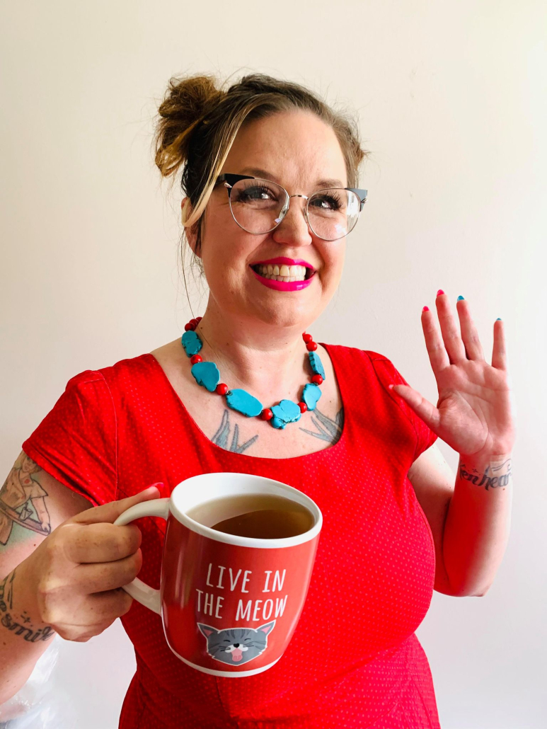Local Food Business Coach Mandi Lunan, festival co-organizer, invites the public to sample the caffeinated and decaf bounty via a mini KCF-branded coffee mug on a lanyard during the main event on Saturday, Oct. 14.
