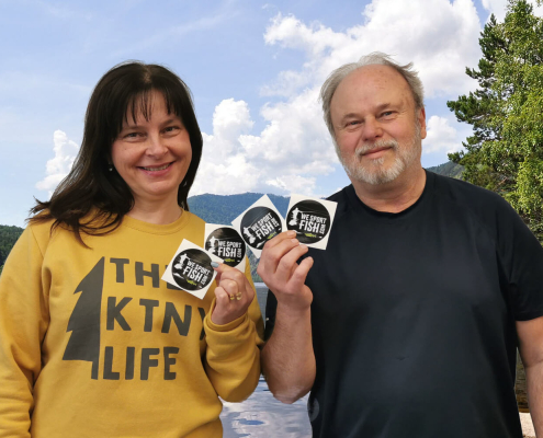 Erika Krest and Ron Perepolkin show off Beyond the River Stick-It! Contest stickers