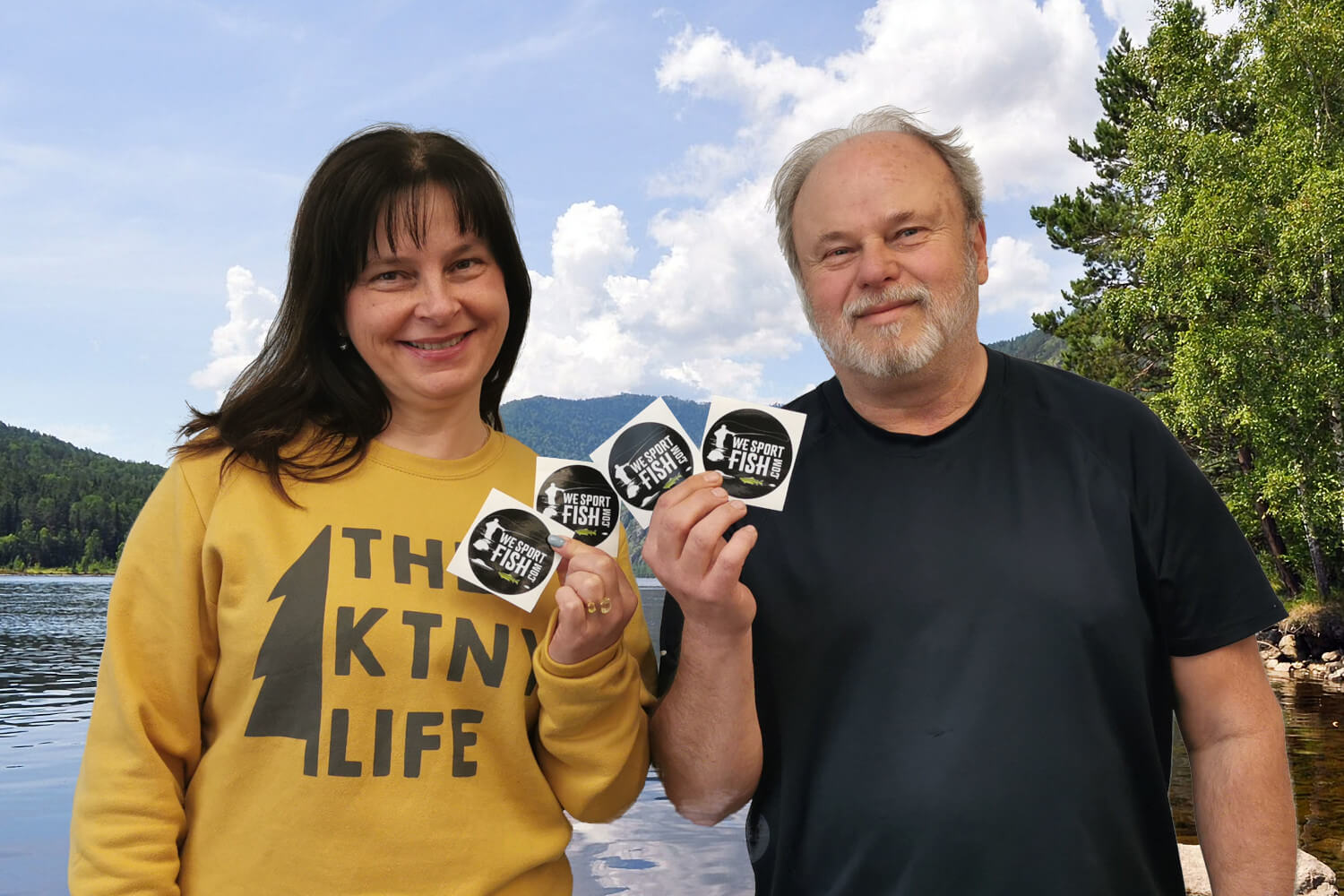 Erika Krest and Ron Perepolkin show off Beyond the River Stick-It! Contest stickers